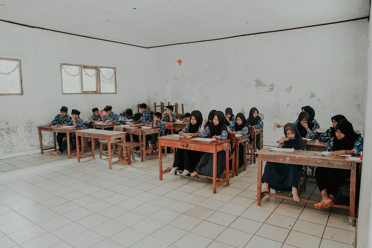 A classroom of students in Pandeglang, Banten, Indonesia, engaged in learning activities.